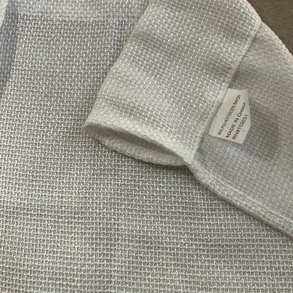 2 Panels Of White Textured Fabric Curtains Each are 63x36